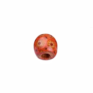 Macro detail of patterned wooden bead with orange finish for hair styling and DIY crafts