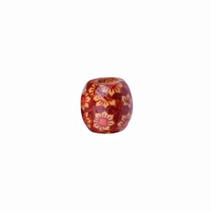 Macro shot of patterned red-brown wooden beads for DIY hair accessories and braids