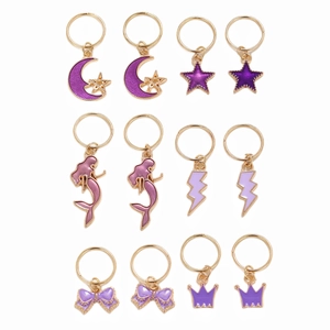 12-piece golden alloy hair charm set featuring purple moon stars mermaid and crown shapes
