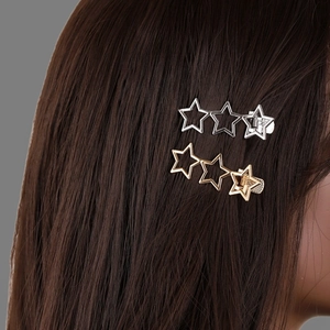Y2K metal star hair clips set in gold and silver finish for women on dark brown hair