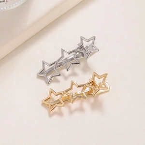 Minimalist Y2K star hair clips set in gold and silver finish with duckbill clip design
