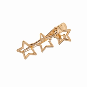 Detailed view of golden hollow triple star hair clip made of polished alloy