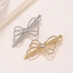 Sparkling rhinestone bow hair clips in gold and silver finish for elegant hair styling