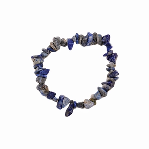 Macro detail of natural irregular blue lapis lazuli stone beads on elastic bracelet
