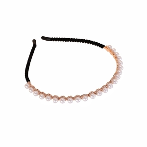 Minimalist rhinestones and pearls floral headband with rose gold metal frame on white backdrop