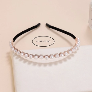 Elegant headband with white pearls and rhinestones on black fabric for women