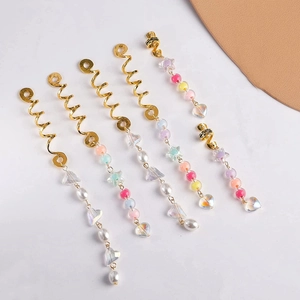 Colorful beaded hair braid pendants with gold spirals, hearts, and stars for DIY styling