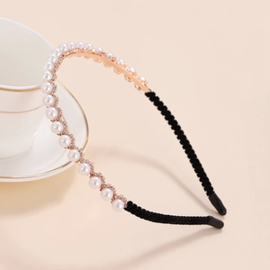 Elegant floral headband with white pearls and small rhinestones on a gold metal frame
