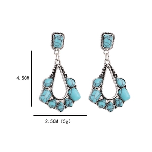 Vintage silver Bohemian earrings with turquoise stones in hollow geometric teardrop shape