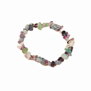 Macro shot of natural amethyst and fluorite irregular crystal stone beaded bracelet