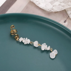 Bohemian gold spiral ear cuff featuring natural raw white crystal stone pendants on ceramic
