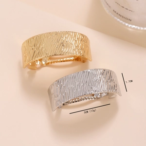 Textured metal ponytail clips in gold and silver finish with brushed surface, 5cm length