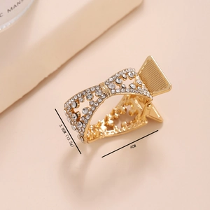 Macro shot of gold alloy hair claw clip with rhinestones and detailed 3.5cm size markings