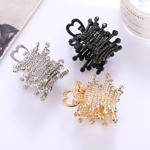 Three-piece metal heart hair claws with rhinestones in silver, black, and gold finishes