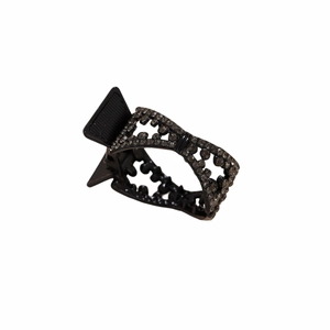 Close-up of black metal bow hair claw clip with rhinestones and hollow-out detail