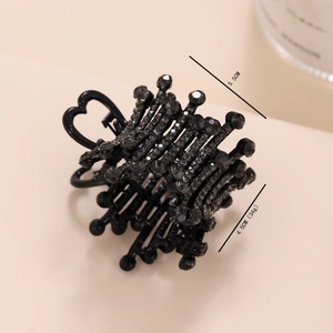 Macro shot of 5.5cm black heart hair claw with rhinestones for high ponytails
