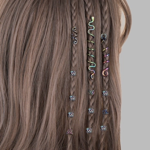 Rainbow metal hair cuffs and spiral snake rings for viking braids on brown hair