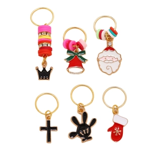 Detail of 6pcs Christmas dreadlock ring charms with Santa, bells, and crown pendants