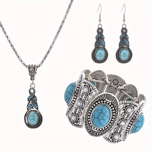 Detailed view of vintage bohemian jewelry set with turquoise stones and engraved patterns
