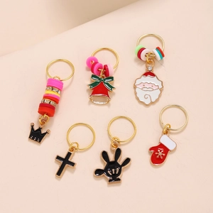 Detailed view of Christmas themed metal alloy hair charms with colorful enamel finish