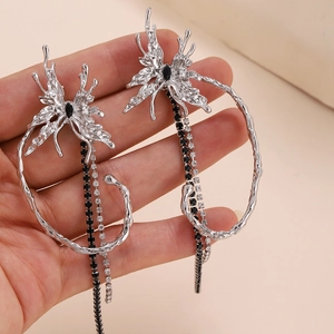 Silver liquid butterfly tassel earrings with black gemstones and branch texture design