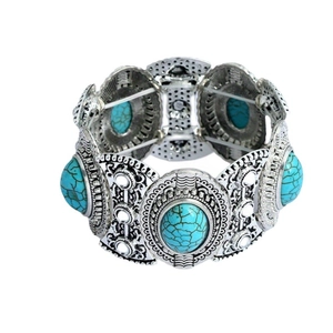 Vintage bohemian stretch bracelet featuring turquoise stones and silver-tone floral carvings