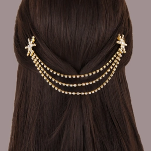 Three-layer gold rhinestone hair chain with star clips and snowflake fringe on brown hair