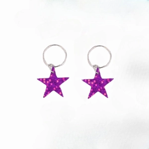 Detail of purple glitter star hair rings with silver metallic hoops for Y2K braids