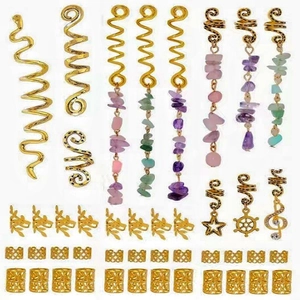 Detailed macro view of gold-plated hair rings with natural stone pendants for dreadlocks