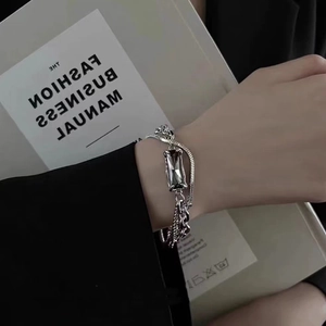 Titanium steel bracelet featuring a grey zircon stone and asymmetric mixed chain link design