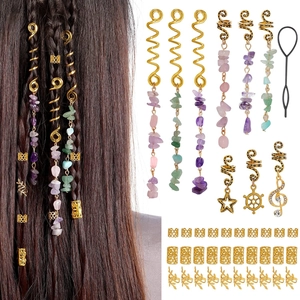 Detail of gold metal hair rings with natural stone pendants and braid accessories