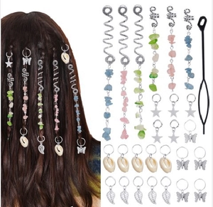 Detail of boho hair braid rings with natural stone charms and metal leaf pendants