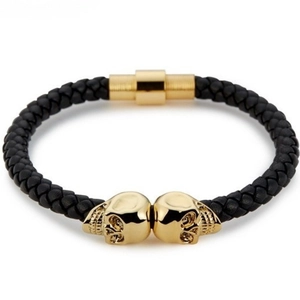 Men's punk braided black leather bracelet with dual gold skull charms and magnetic clasp