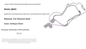 Detailed view of titanium steel layered necklace with beads and geometric pendants