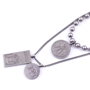 Detail of vintage silver titanium steel necklace with rectangular and round pendants