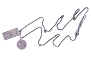 Detail of vintage punk titanium steel necklace with rectangular and round pendants