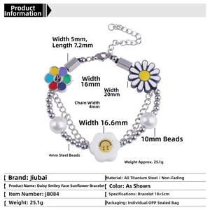 Détail d'un bracelet double chaîne en acier titane avec marguerites et symboles de paix