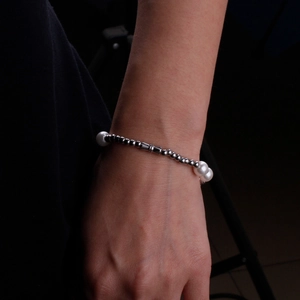 Handmade pearl and silver bead bracelet for couples featuring a minimalist metal clasp