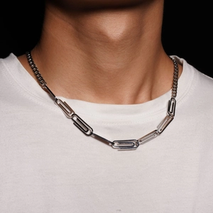 Modern titanium steel paperclip necklace with Cuban chain links on a white t-shirt