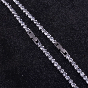 Detail of round-cut cubic zirconia tennis necklace with silver-tone folding clasp