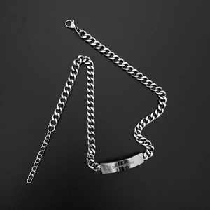 Titanium steel cuban chain bracelet with a curved Serendipity engraved bar pendant