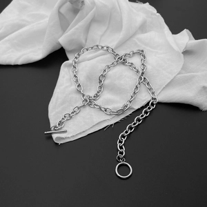 Detailed view of silver stainless steel curb chain with industrial OT toggle closure