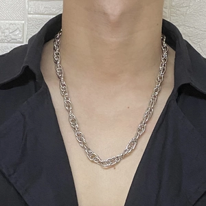 Polished silver chunky metal chain necklace for men and women on black shirt