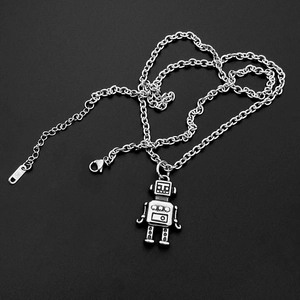 Detailed close-up of retro silver robot pendant with textured mechanical punk elements