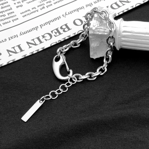 Unisex cuban link chain bracelet in stainless steel with large lobster clasp and tag