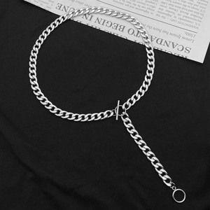 Unisex silver Cuban link chain necklace with toggle clasp and ring pendant on black cloth