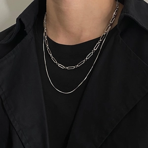 Minimalist double layer silver chain necklace with paperclip and snake links on model