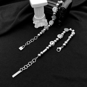 Detail of hip-hop stainless steel bead bracelets with blue diamond smiley faces