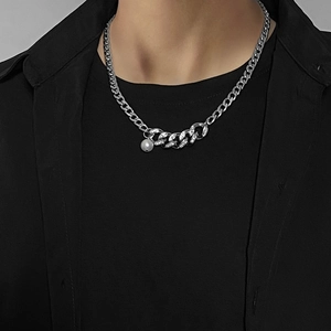 Hip hop silver Cuban chain necklace with white pearls and diamond accents on a model