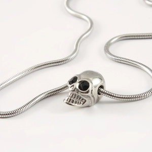 Vintage gothic skull pendant necklace in silver stainless steel with black stone eyes